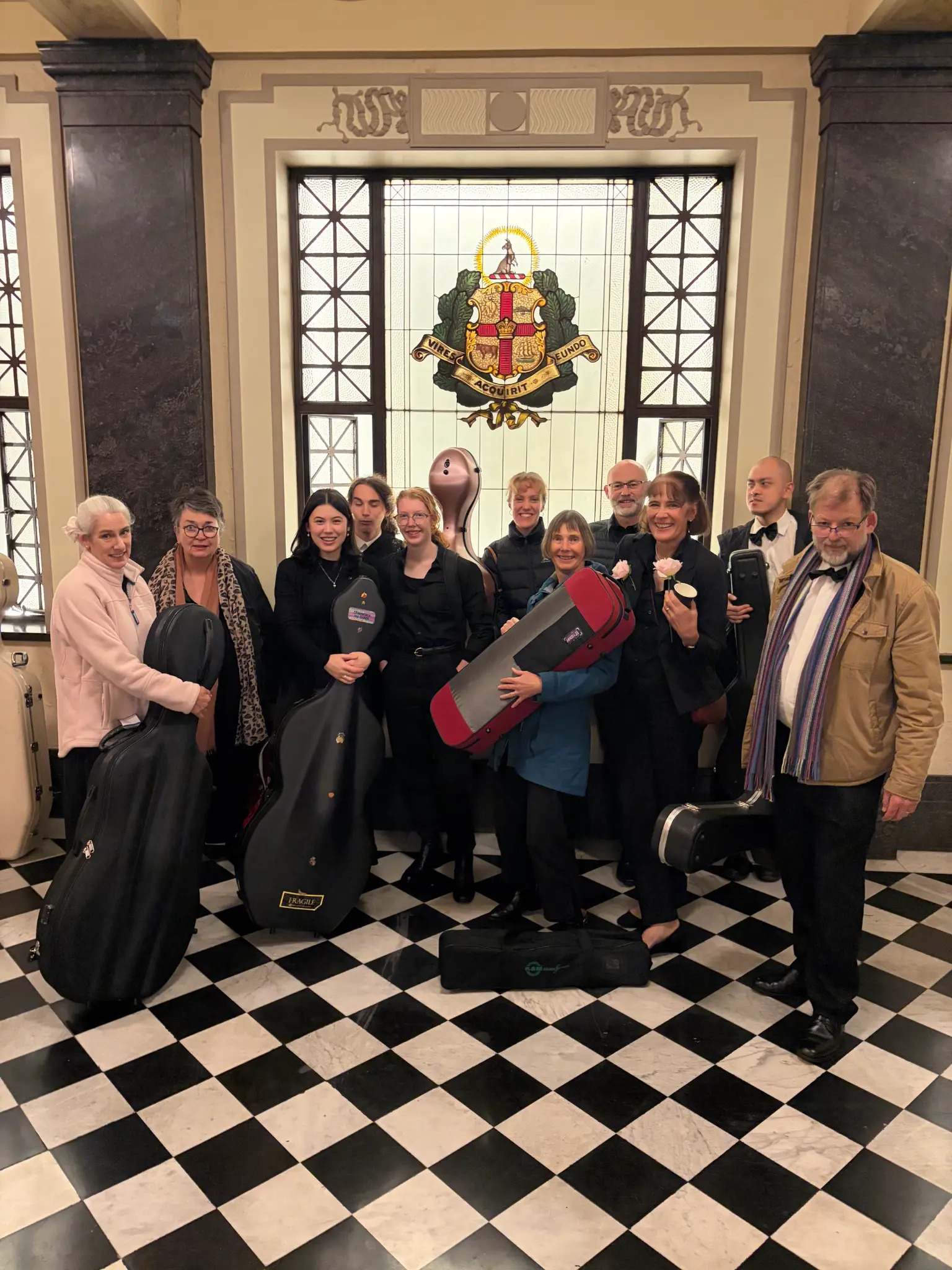 Exalt Strings orchestra members with instrument cases
